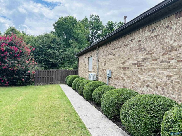 ranch-style home with a front yard and a garage