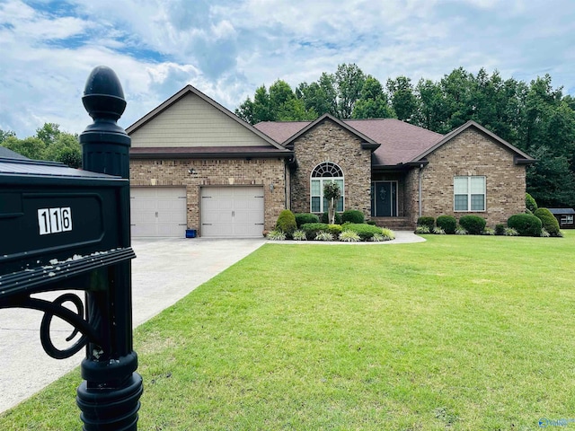 view of front facade with a garage and a front lawn