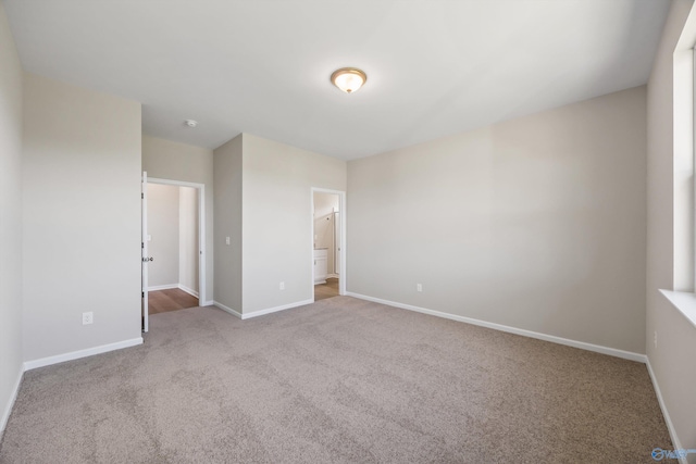 unfurnished bedroom featuring light colored carpet