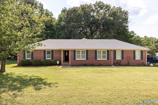 ranch-style home with a front lawn