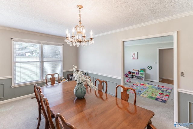 carpeted dining area featuring a textured ceiling, an inviting chandelier, a healthy amount of sunlight, and crown molding