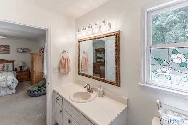 bathroom featuring a textured ceiling and vanity