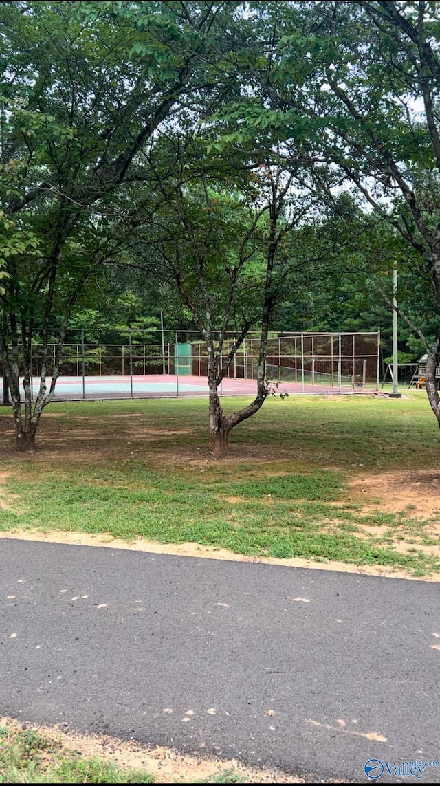 view of yard with tennis court