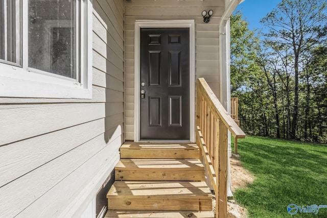 entrance to property with a yard