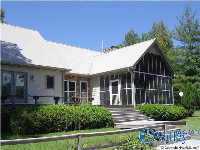 rear view of house with a sunroom