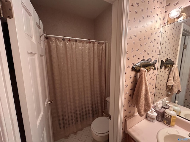 bathroom featuring tile patterned flooring, vanity, and toilet