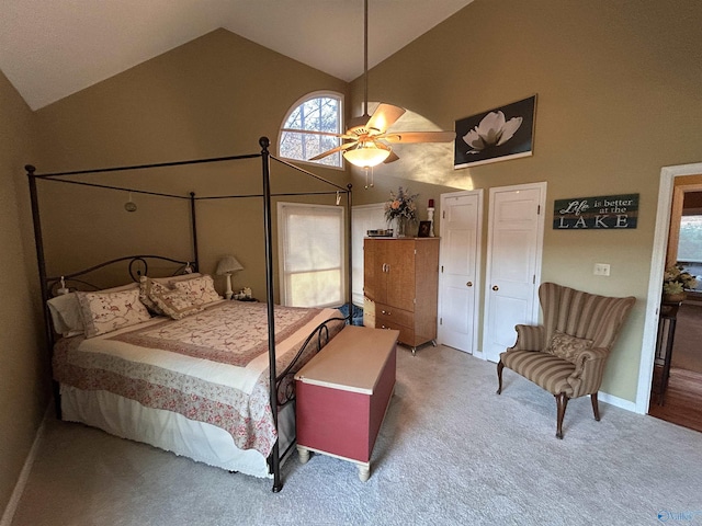 bedroom featuring ceiling fan, carpet flooring, and high vaulted ceiling