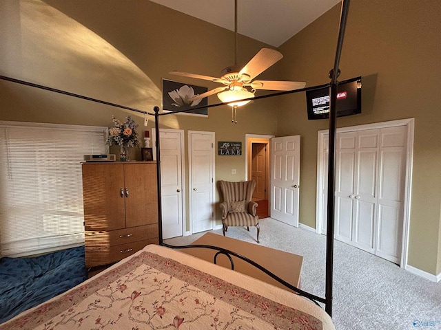 unfurnished bedroom with ceiling fan, carpet floors, high vaulted ceiling, and a closet