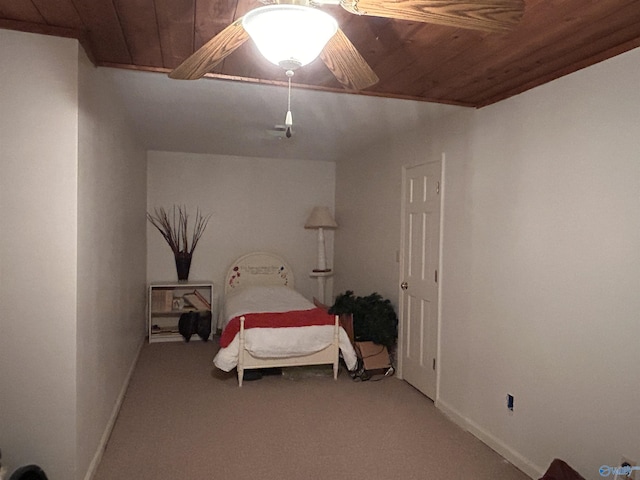 bedroom with wood ceiling, carpet floors, and ceiling fan