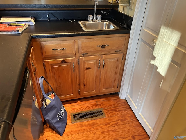 kitchen featuring dark hardwood / wood-style flooring and sink