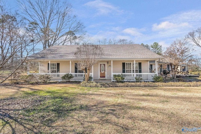 single story home featuring a porch, roof with shingles, and a front yard