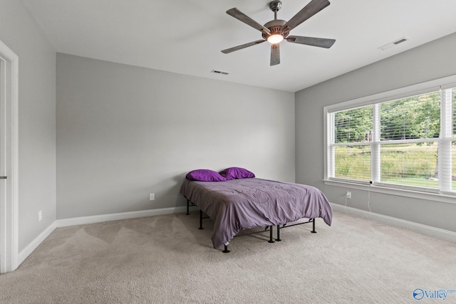 bedroom with carpet, baseboards, and ceiling fan