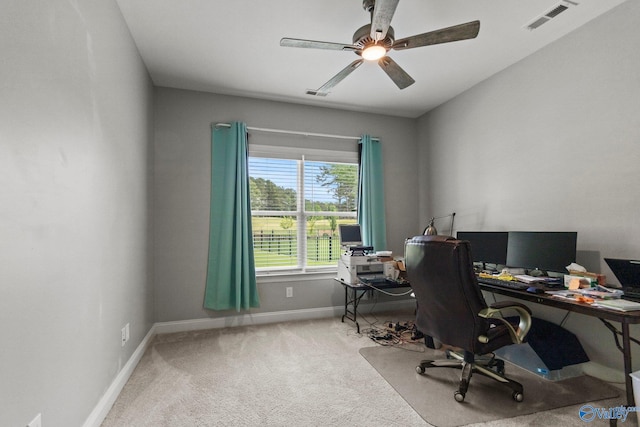 office space with baseboards, carpet flooring, and ceiling fan