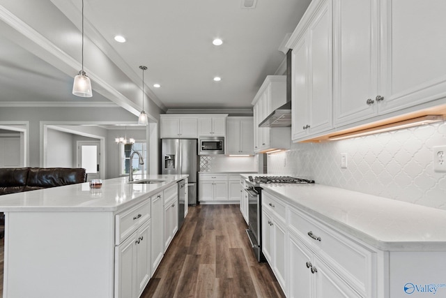 kitchen with stainless steel appliances, a sink, white cabinetry, crown molding, and dark wood finished floors