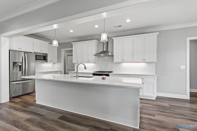 kitchen featuring appliances with stainless steel finishes, a sink, ornamental molding, white cabinetry, and light countertops