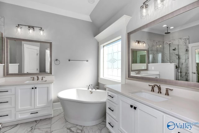 bathroom with vanity, ornamental molding, and separate shower and tub