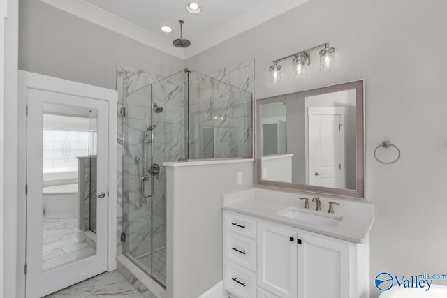 bathroom featuring vanity and an enclosed shower