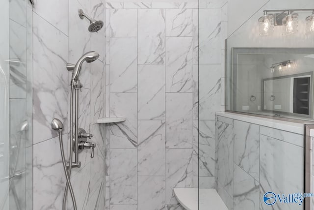 bathroom with tiled shower