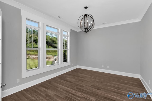 unfurnished dining area with crown molding, dark hardwood / wood-style floors, and a notable chandelier