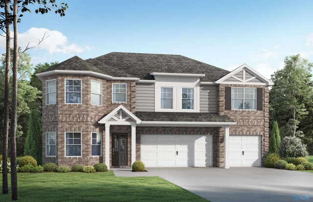 view of front of house featuring a garage and a front lawn