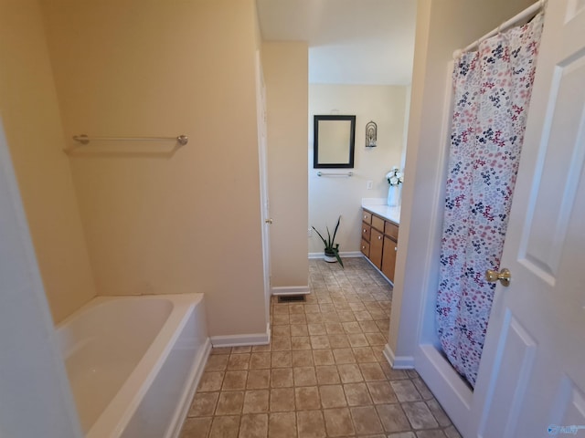 bathroom with vanity and a tub to relax in