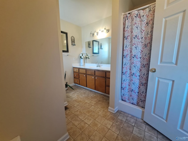 bathroom featuring vanity and a shower with curtain