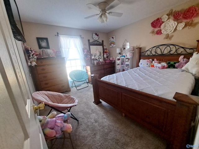 bedroom with ceiling fan and carpet flooring