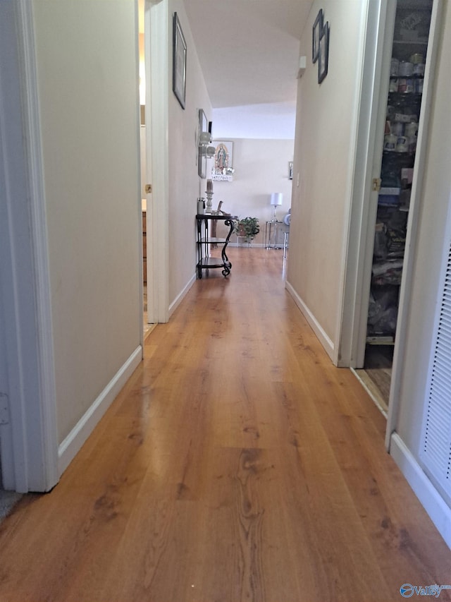 corridor featuring hardwood / wood-style floors