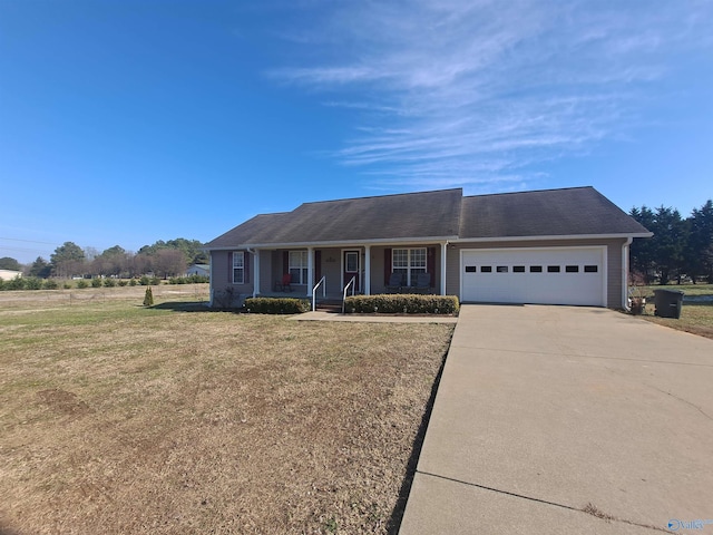 ranch-style house featuring a garage, a front lawn, and covered porch