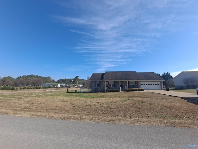 view of front facade with a garage and a front yard