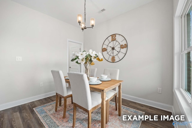 2652 Ajs Arbor Dr NW, Huntsville, AL 35810 - dining area featuring baseboards, wood finished floors, a chandelier, and visible vents