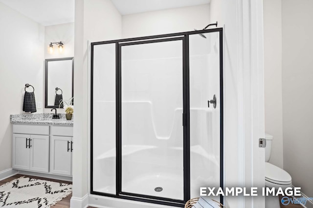 2652 Ajs Arbor Dr NW, Huntsville, AL 35810 - full bath featuring a shower stall, baseboards, vanity, and wood finished floors