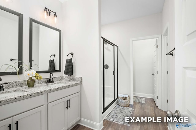 2652 Ajs Arbor Dr NW, Huntsville, AL 35810 - bathroom with a shower stall, wood finished floors, and a sink