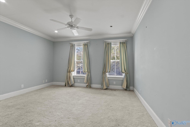 unfurnished room with crown molding, ceiling fan, and light colored carpet