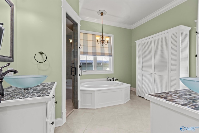 bathroom featuring vanity, separate shower and tub, ornamental molding, a notable chandelier, and tile patterned flooring