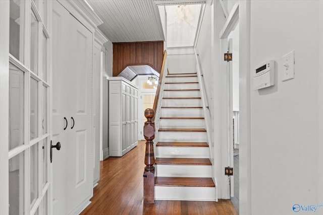 staircase featuring wood-type flooring