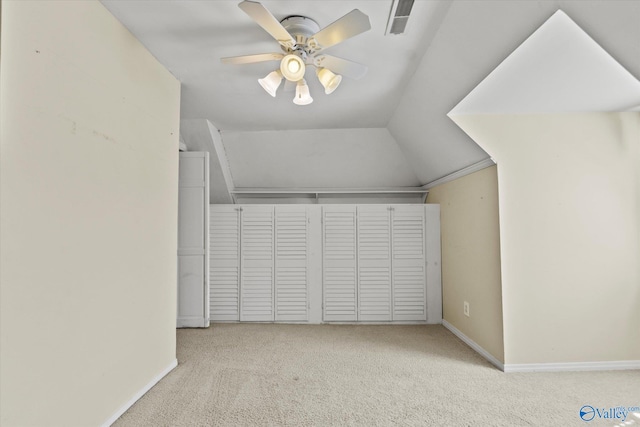 bonus room with light carpet, lofted ceiling, and ceiling fan