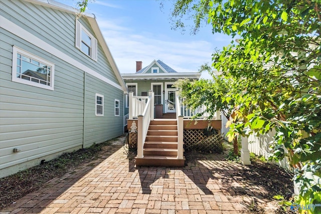 exterior space with a patio area and a deck