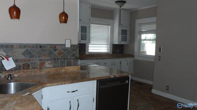708 E 9th St, Anniston, AL 36207 - kitchen with dishwasher, a sink, white cabinets, decorative backsplash, and crown molding