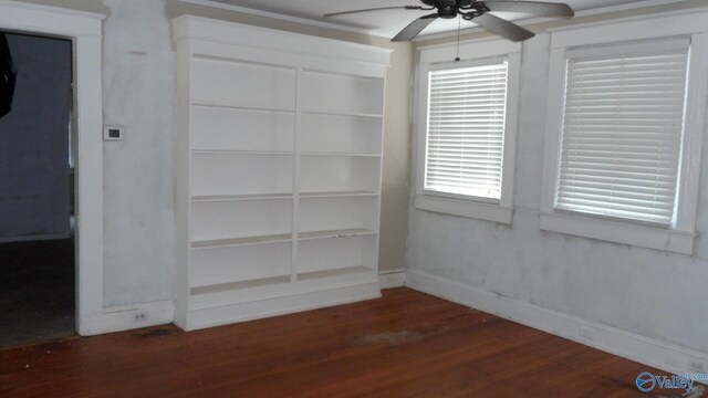 708 E 9th St, Anniston, AL 36207 - empty room featuring ceiling fan, wood finished floors, and baseboards