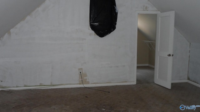 708 E 9th St, Anniston, AL 36207 - additional living space with vaulted ceiling, carpet floors, and baseboards