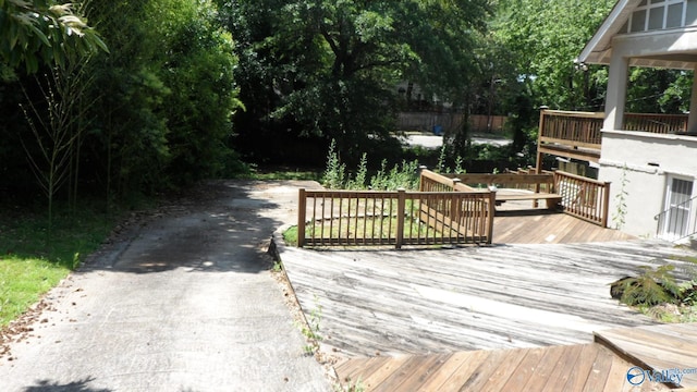 708 E 9th St, Anniston, AL 36207 - wooden terrace with driveway