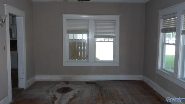 708 E 9th St, Anniston, AL 36207 - unfurnished room with baseboards and wood finished floors
