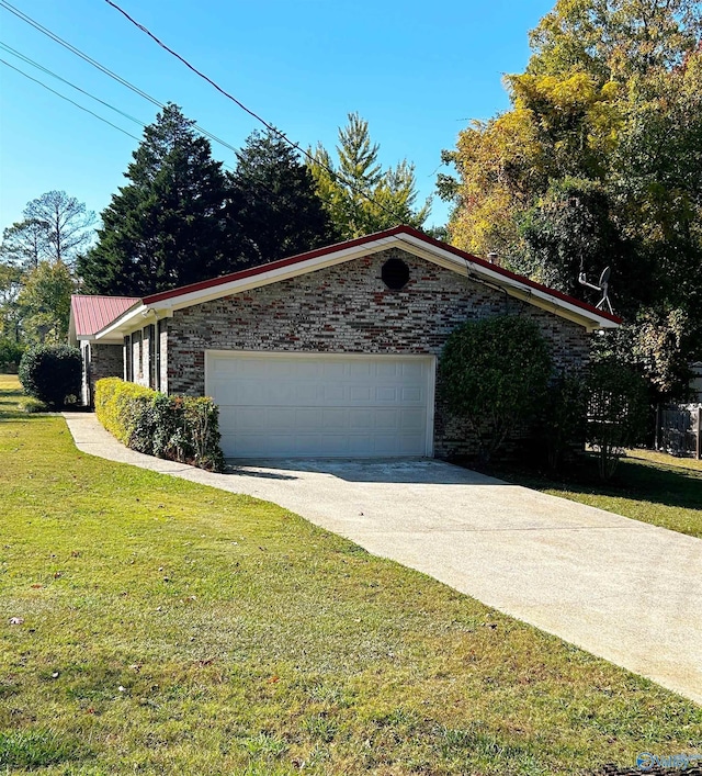 view of side of home with a lawn