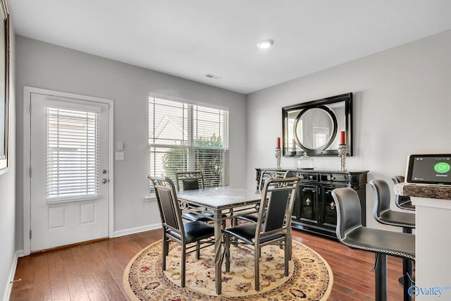 dining area featuring hardwood / wood-style flooring