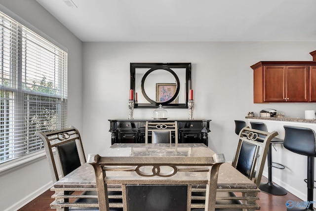 dining area featuring dark hardwood / wood-style floors