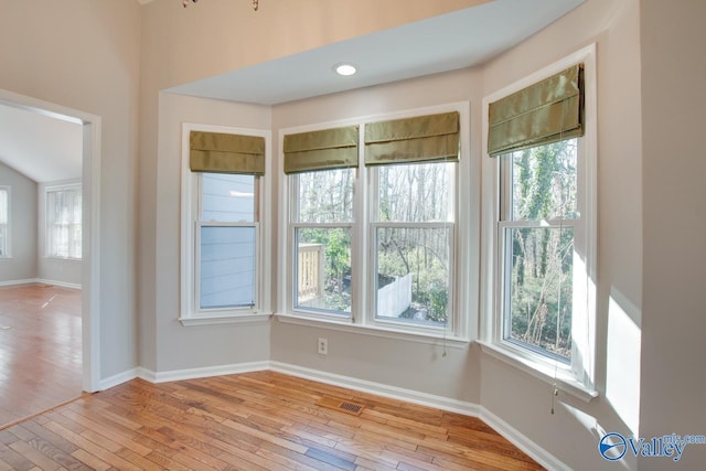 unfurnished room with light hardwood / wood-style floors