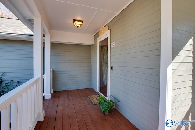 wooden deck featuring covered porch