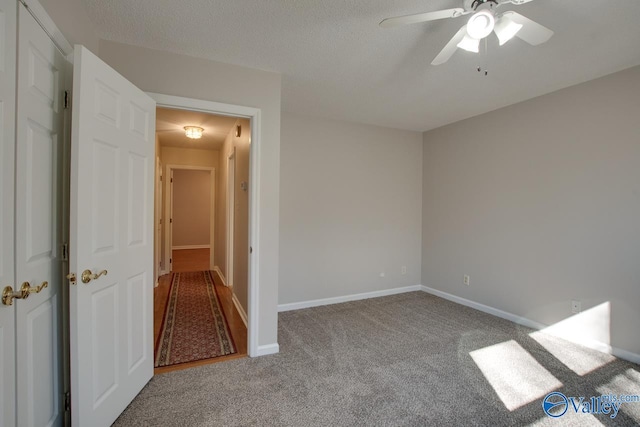 spare room with light carpet and ceiling fan