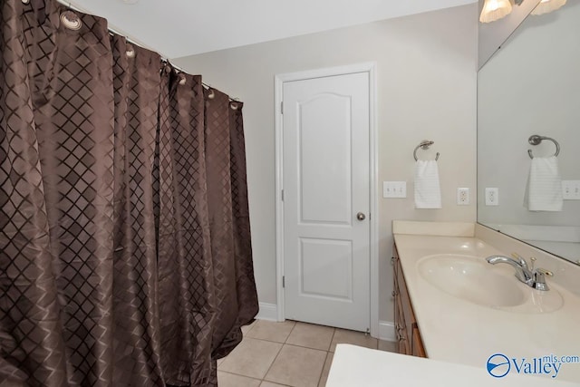 bathroom featuring tile patterned floors, vanity, and a shower with shower curtain